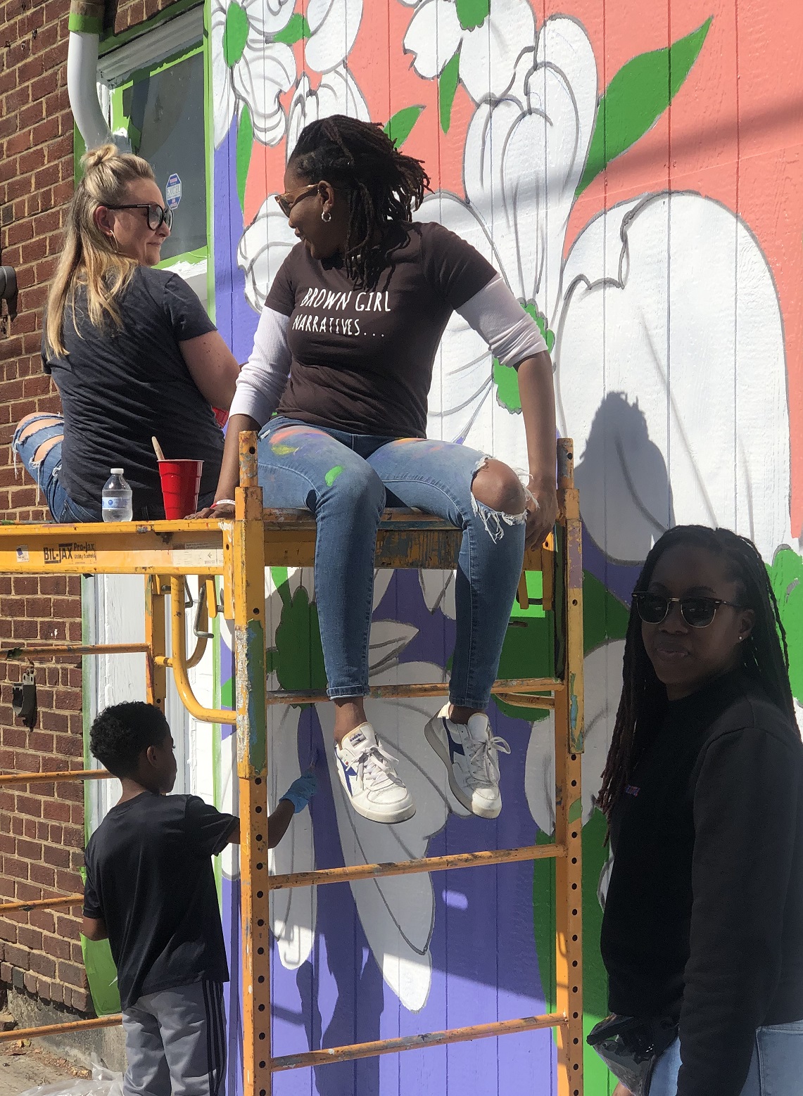 Kristal and Dr. LaRose work on Kristal's community mural